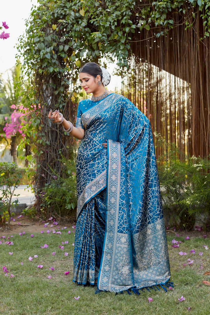 Stunning blue Kanjivaram soft satin silk saree with detailed butta work, ideal for grand celebrations and festive wear.