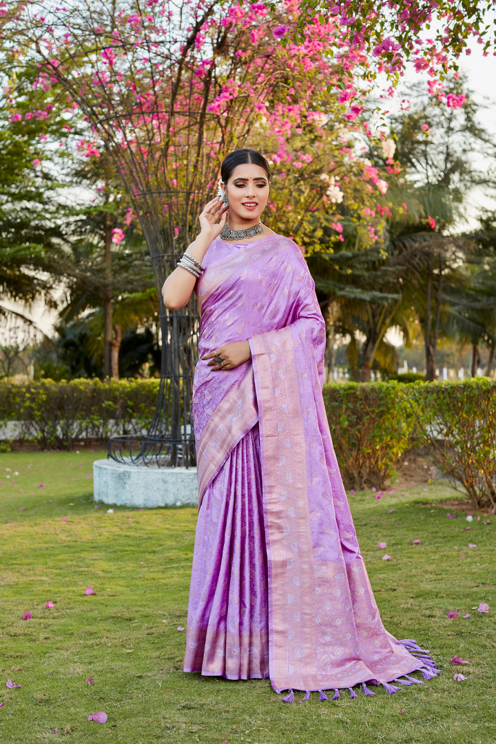 Beautiful lavender satin silk Kanjivaram saree with delicate butta work and woven pallu, ideal for cultural occasions.