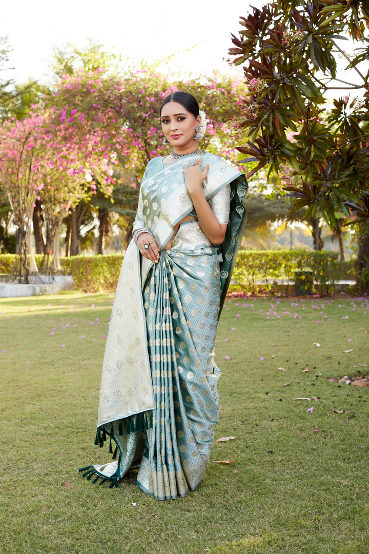 Sky blue Kanjivaram saree with a radiant satin finish, detailed with stunning weaving butta work and rich woven pallu.