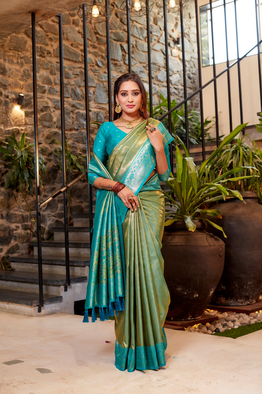 Beautiful pink Tissue silk saree with elegant contrast border and delicate weave.