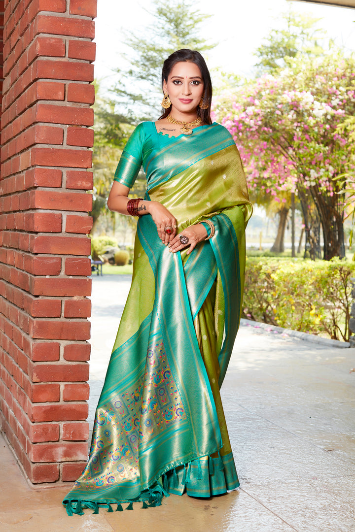 Chic parrot-green tissue silk saree with rich pallu and contrast blouse, ideal for grand occasions.