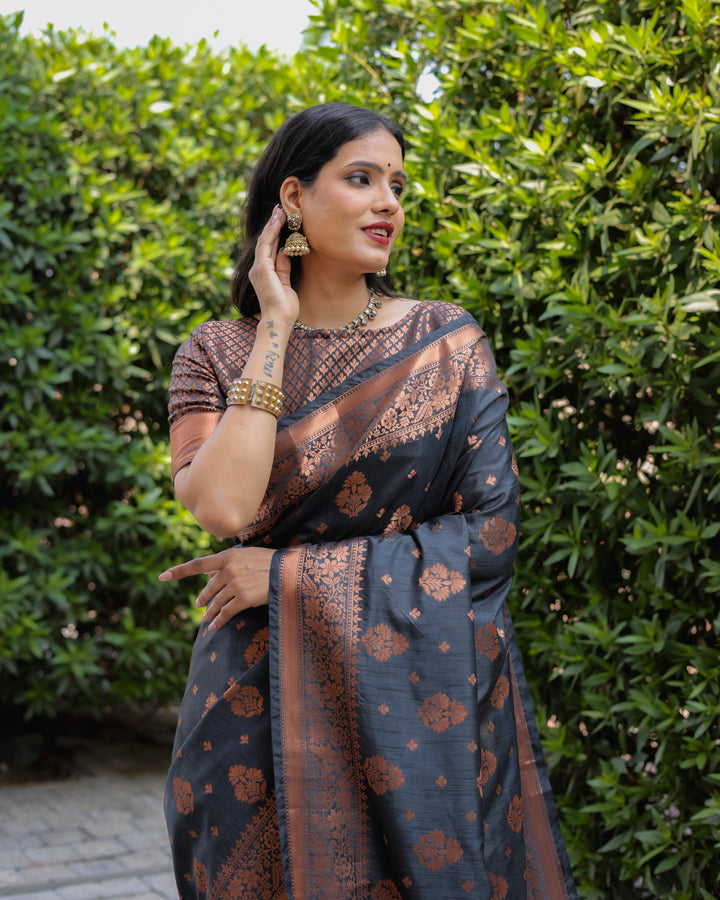 Elegant black soft silk saree with copper work and contrast woven borders, perfect for festive events.