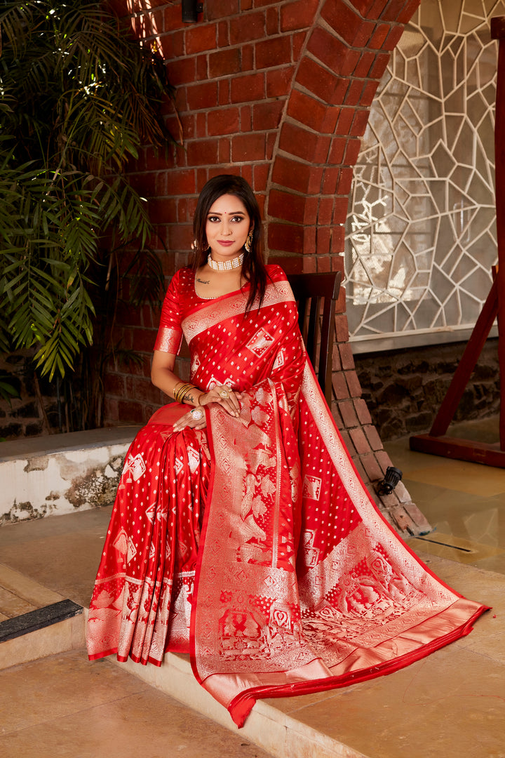 Rich red Kanjivaram silk saree featuring a designer border and woven pallu, offering elegance and sophistication for special occasions.