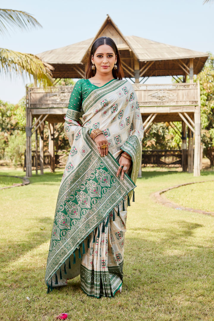 Green soft silk Kanjivaram saree with intricate borders and elegant traditional appeal.