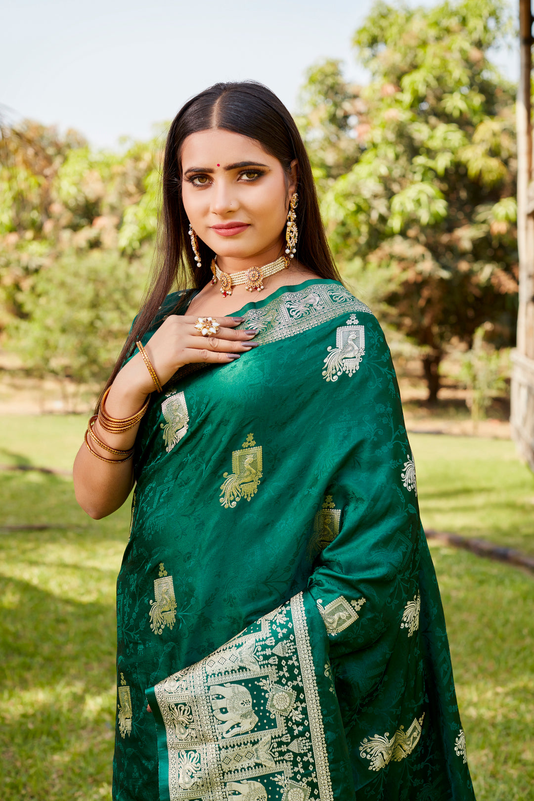 Exquisite red satin Kanjivaram saree with a traditional elephant border, ideal for festive celebrations and cultural occasions.