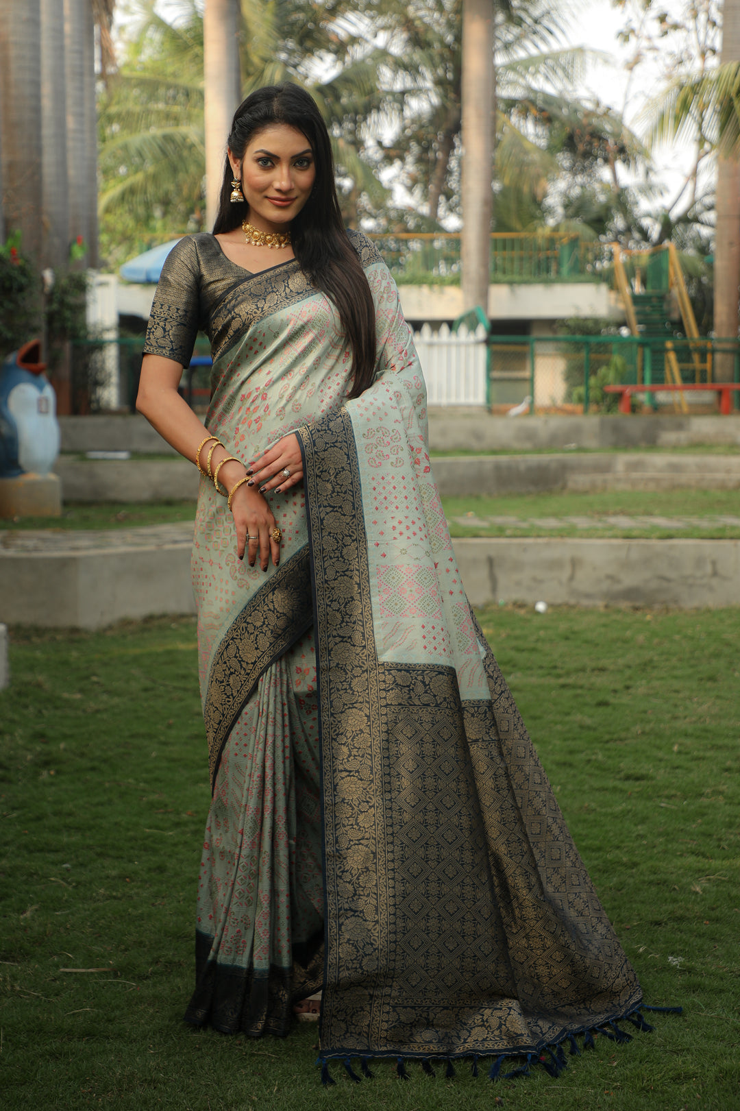 Vibrant pink Kanjivaram silk saree with rich hues and elegant detailing for festive events.