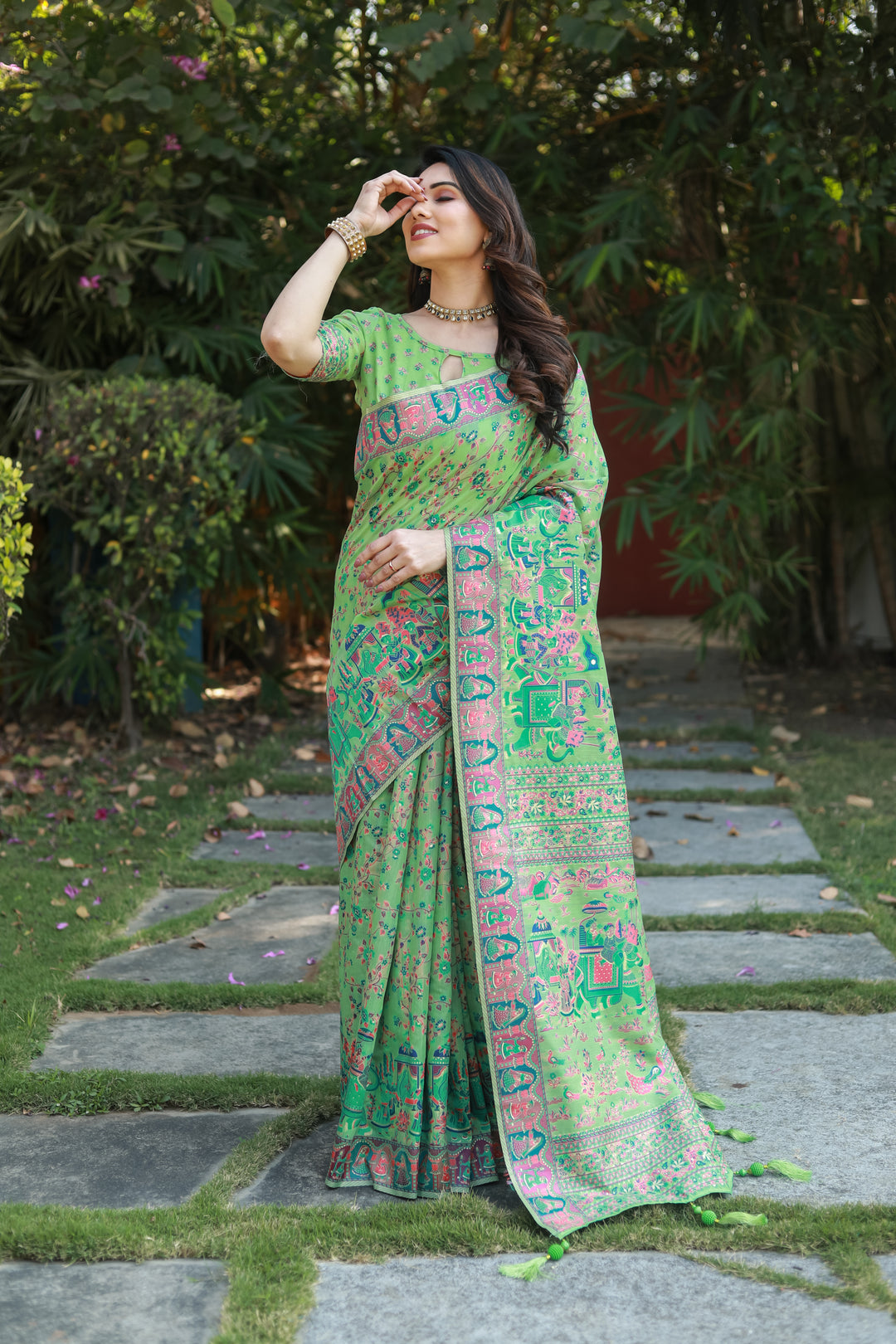 Fresh green Pashmina cotton saree with a vibrant double-sided border and grand pallu, ideal for cultural events.