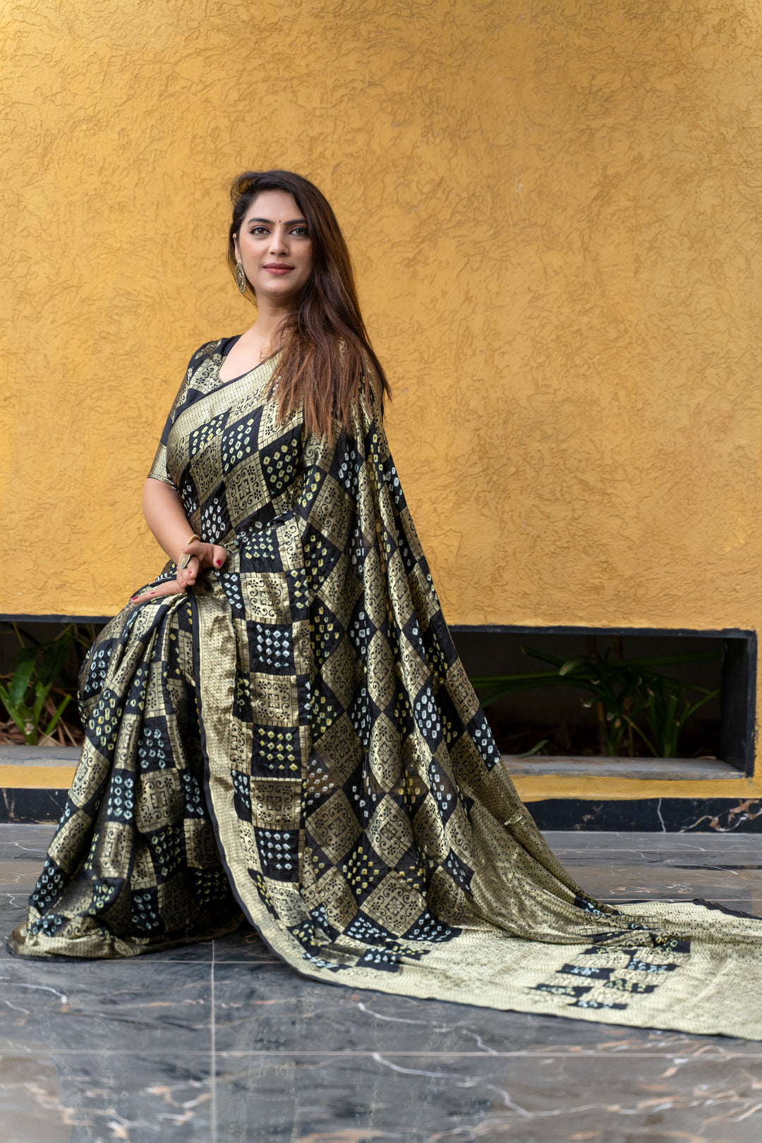 Timeless wine Bandhej silk saree with a luxurious zari border, ideal for grand celebrations and traditional ceremonies.