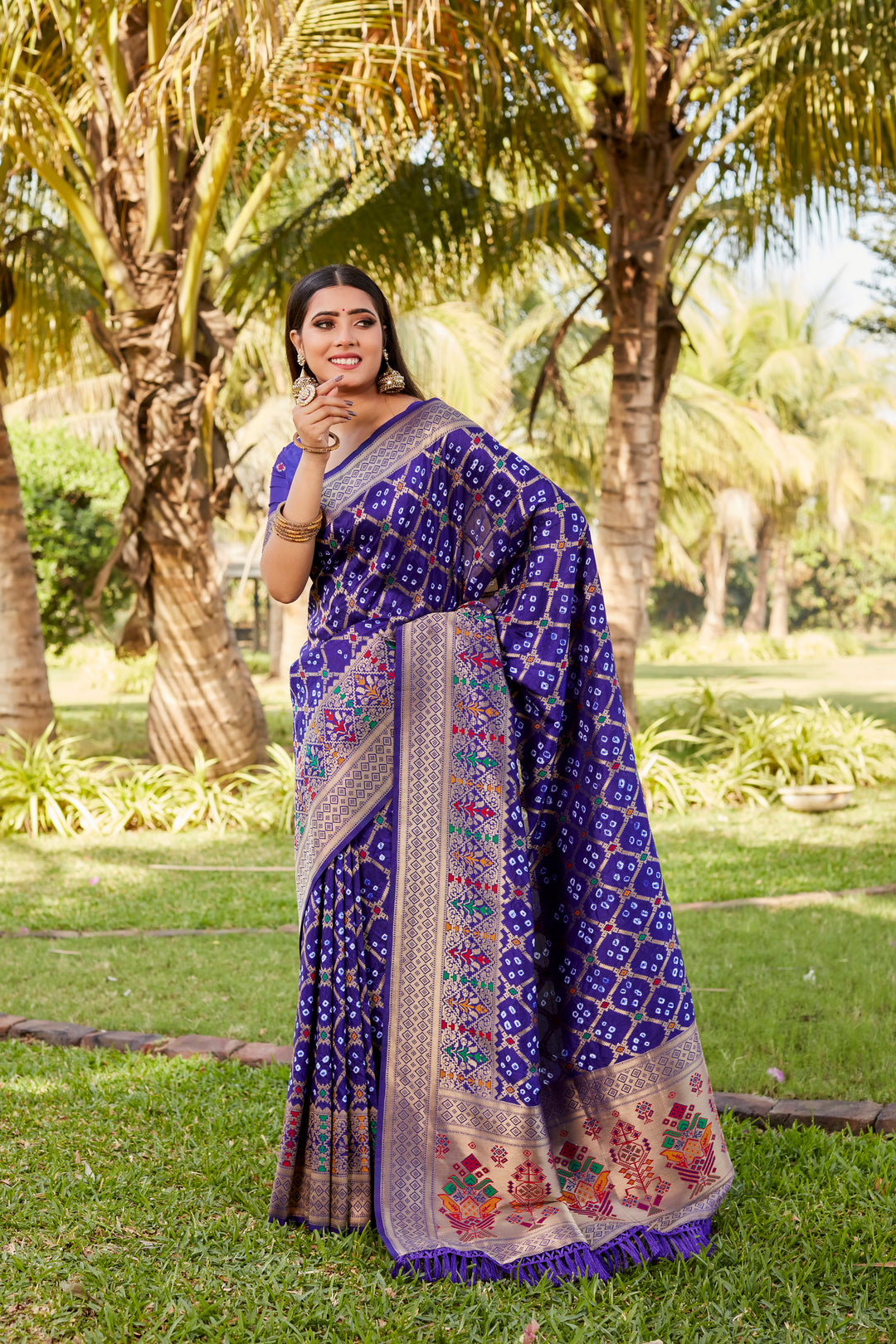 Elegant black Gharchola Bandhej silk saree with beautiful meenakari borders, perfect for weddings, parties, and cultural celebrations.