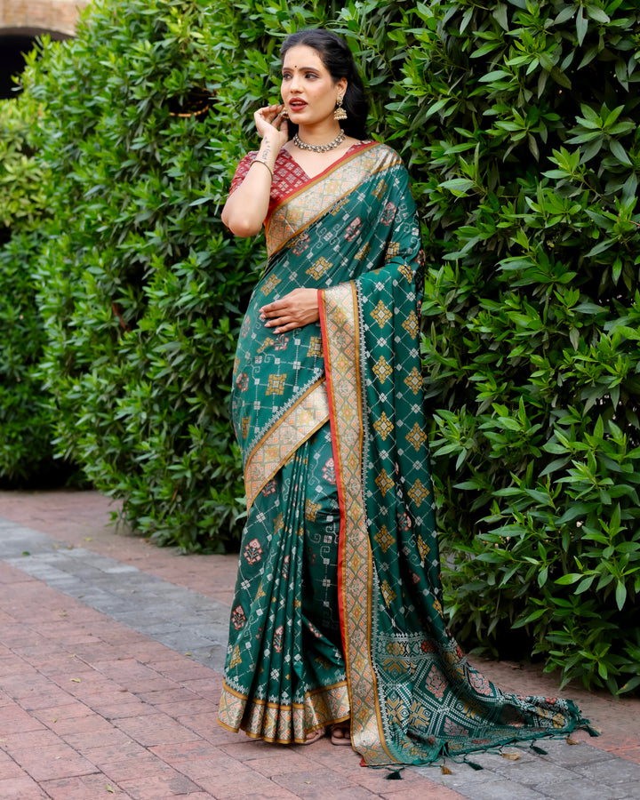 This green Ikkat Patola silk saree features traditional patterns and rich Zari borders, ideal for weddings and grand events.