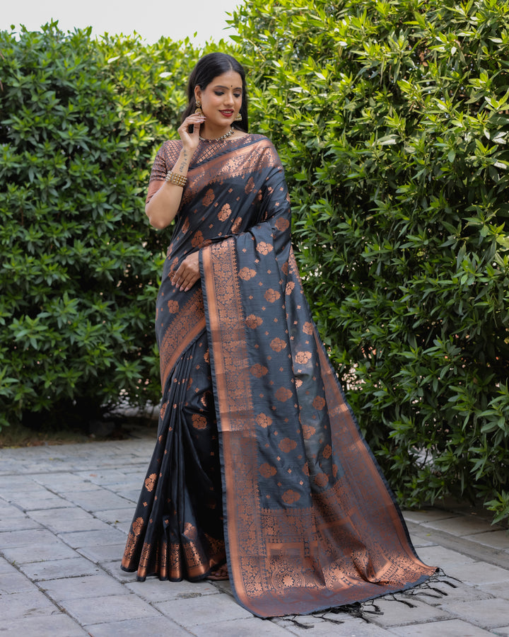 Sophisticated black soft silk saree with a contrast brocade blouse and finely woven pallu, ideal for special occasions.