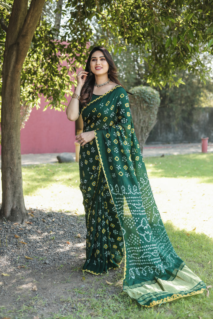 Handwoven Bandhej silk saree with delicate tissue pallu and intricate zari motifs.