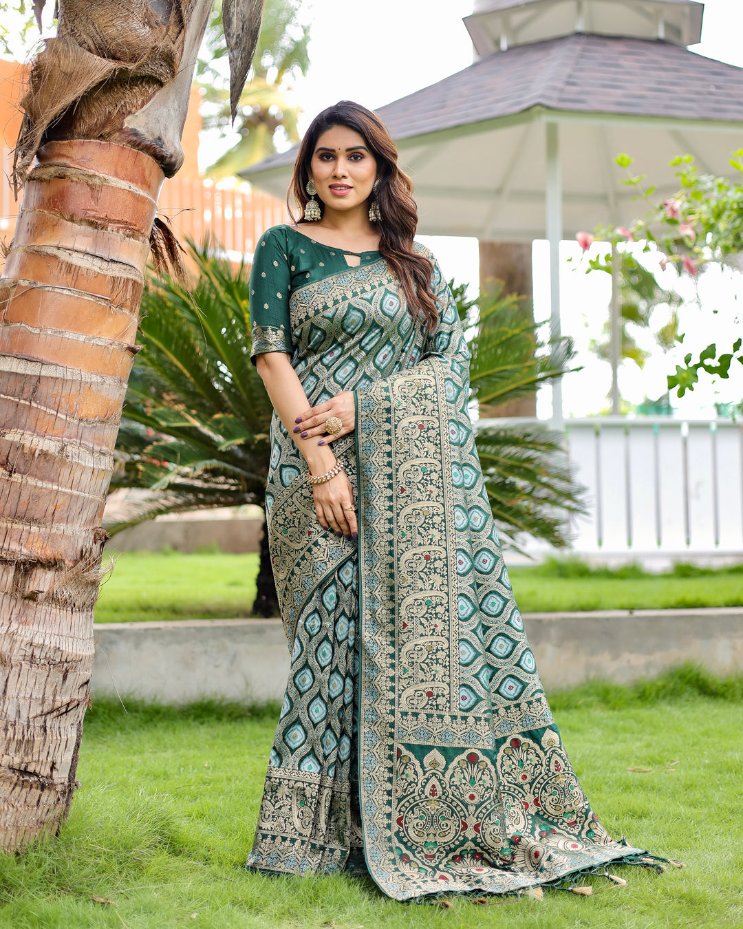 Rich green Kanjivaram Silk Saree with intricate zari work and embossed design, perfect for USA celebrations.