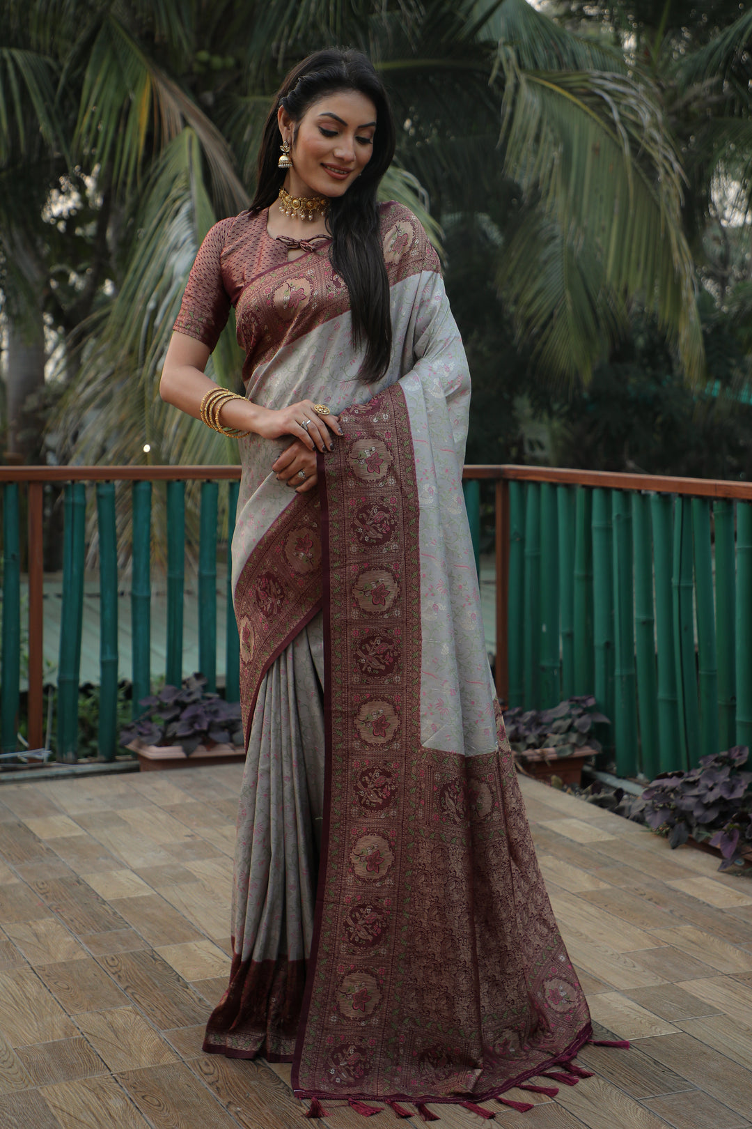 Luxurious grey Kanjivaram silk saree with fine detailing and a radiant shine, perfect for making a statement at any celebration.