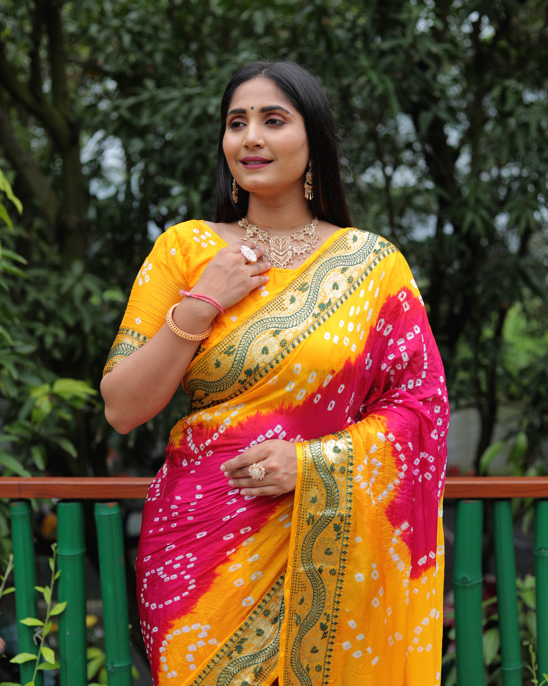 Timeless orange Bandhej Tapeta silk saree with vibrant dual-color design and elegant tie-dye pattern.