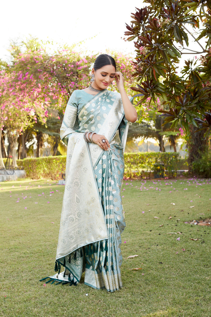 Elegant sky blue Kanjivaram Soft Satin Silk saree with beautiful butta work, perfect for festive occasions and celebrations.