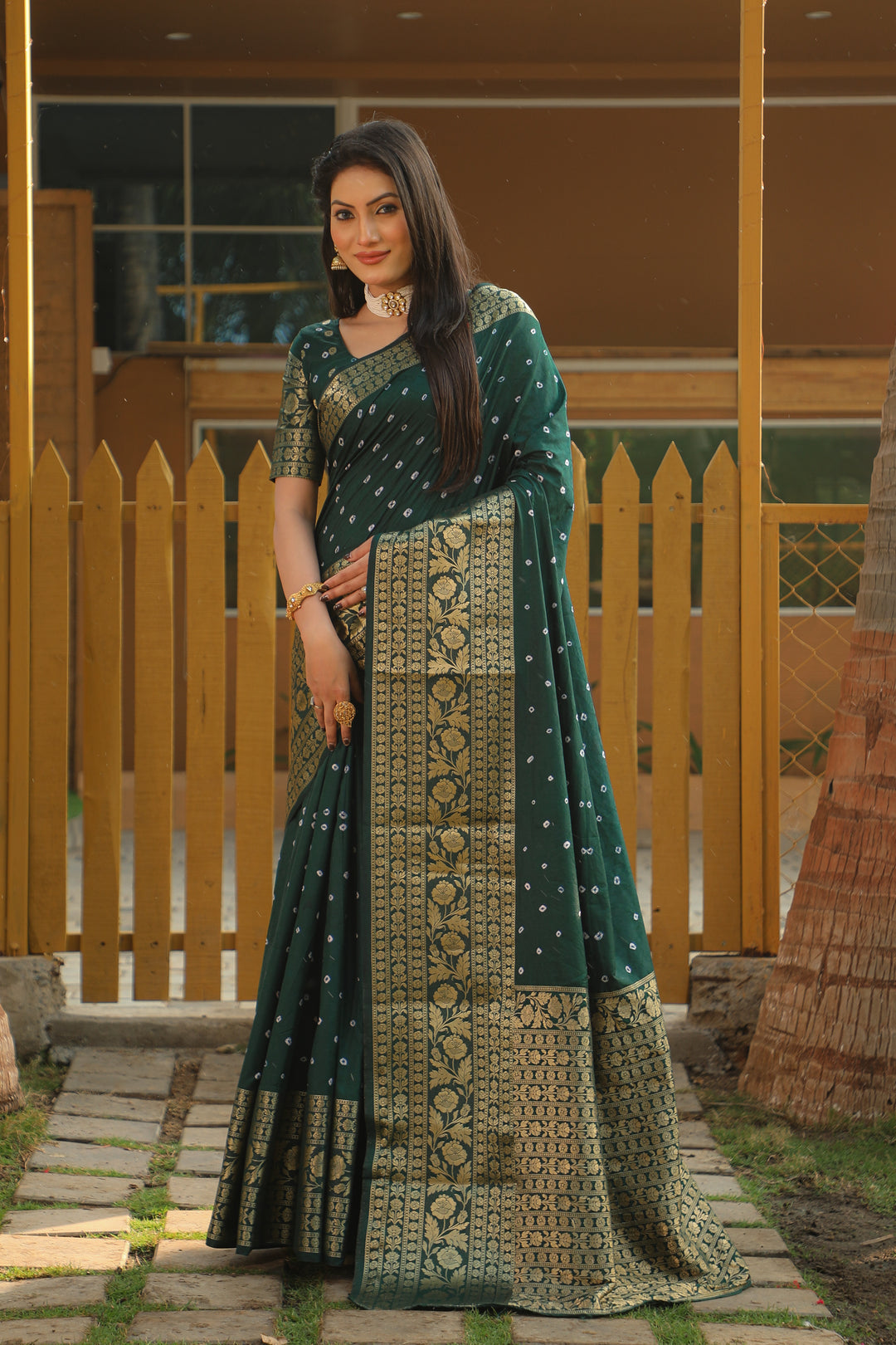 Gorgeous red Bandhej Kanjivaram silk saree featuring intricate zari details and a richly woven pallu, ideal for weddings and bridal wear.