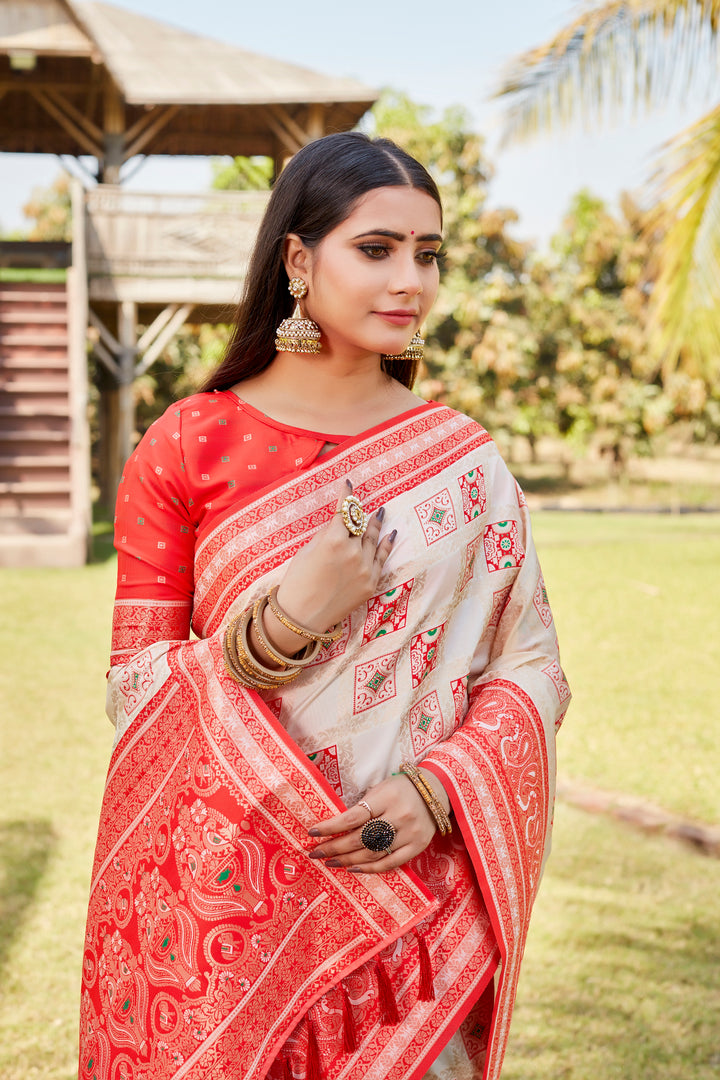 Elegant cream Kanjivaram soft silk saree with intricate designer borders and soft sheen.