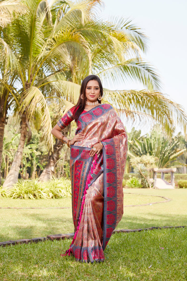 Glamorous bright pink Kanjivaram saree with intricate zari borders and a shimmering pallu, ideal for festive occasions.