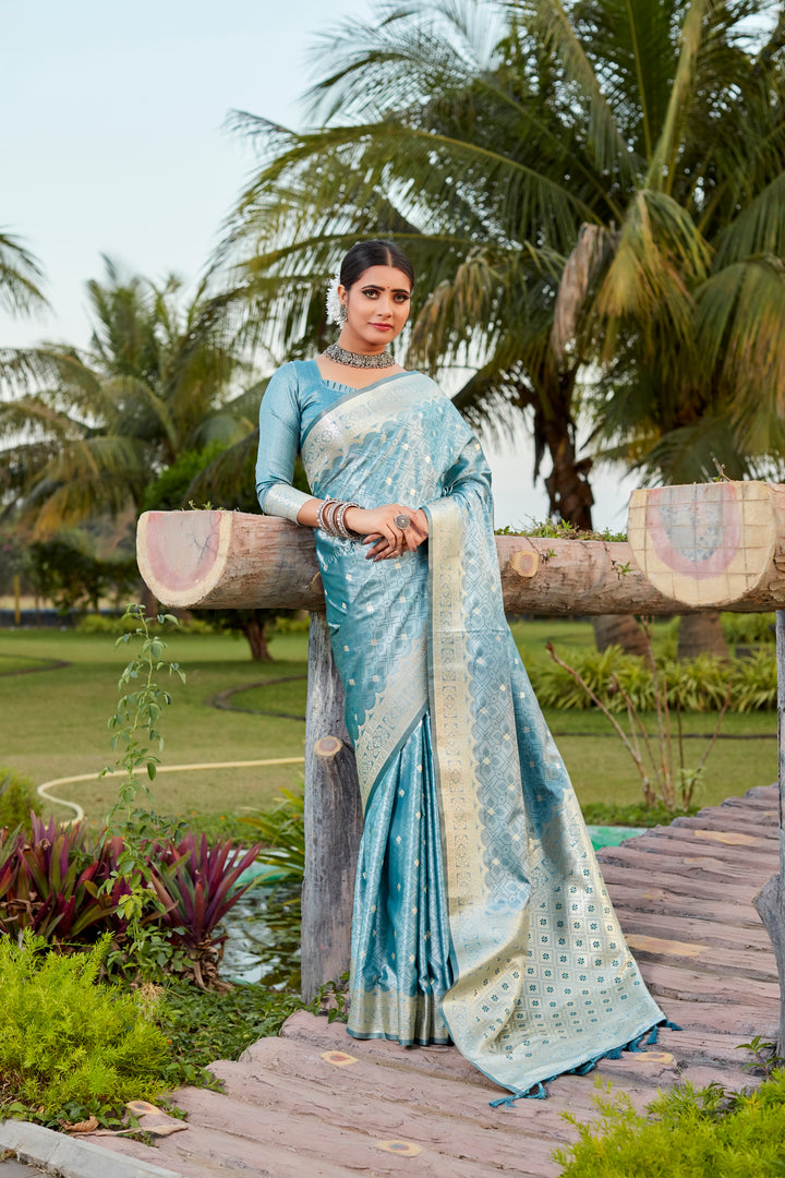 Gorgeous sky-blue Kanjivaram silk saree with intricate butta work and designer border, perfect for bridal wear.