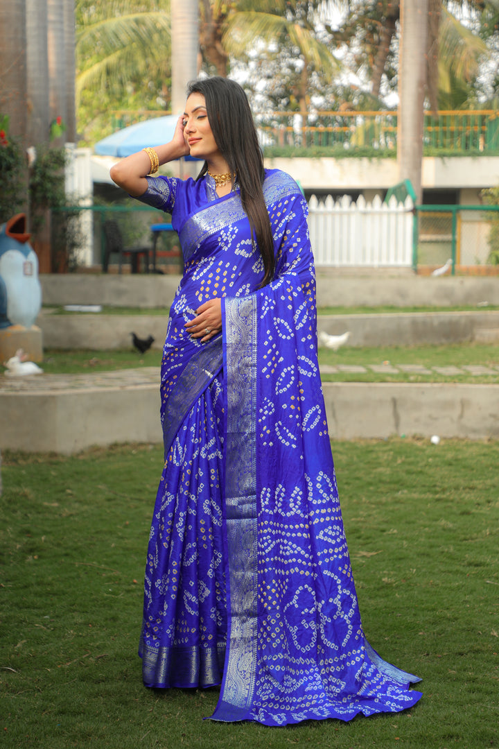 Elegant royal blue Bandhej silk saree with intricate jari weaving and Bandhej pallu, perfect for grand festivities.