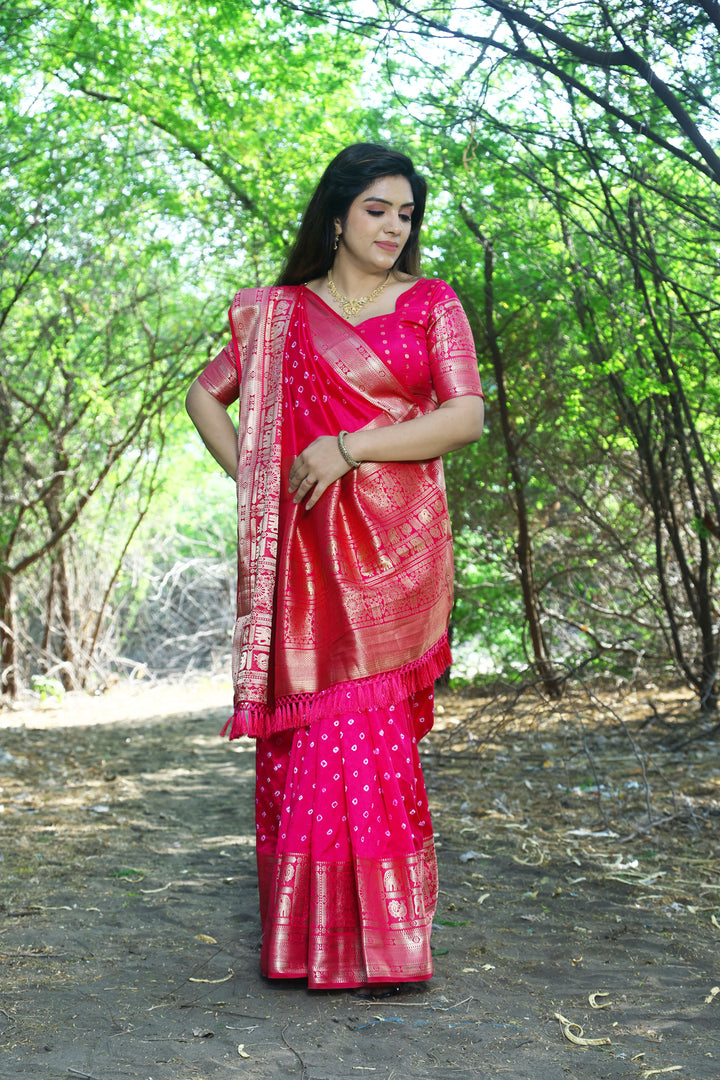 Bold black handmade Bandhej Kanjivaram silk saree with intricate Bandhej patterns and stunning border and pallu.