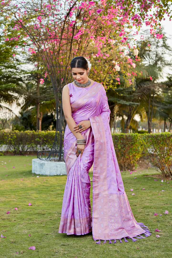 Elegant lavender satin silk Kanjivaram saree featuring butta design and woven pallu, perfect for traditional events.