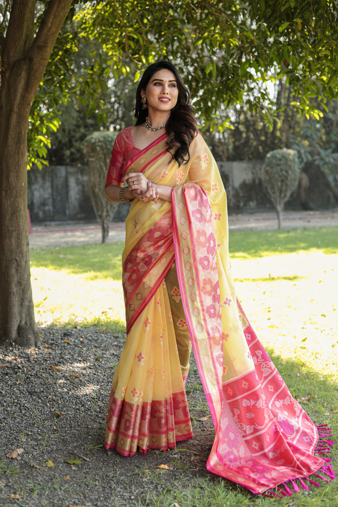 Graceful yellow Ikkat weave Organza saree, designed with lightweight comfort for any special event.