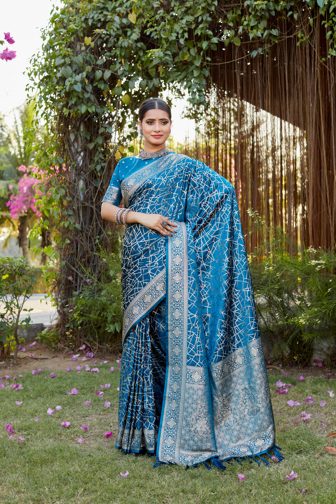 Graceful blue Kanjivaram soft satin silk saree with intricate butta work, perfect for traditional and luxury occasions.