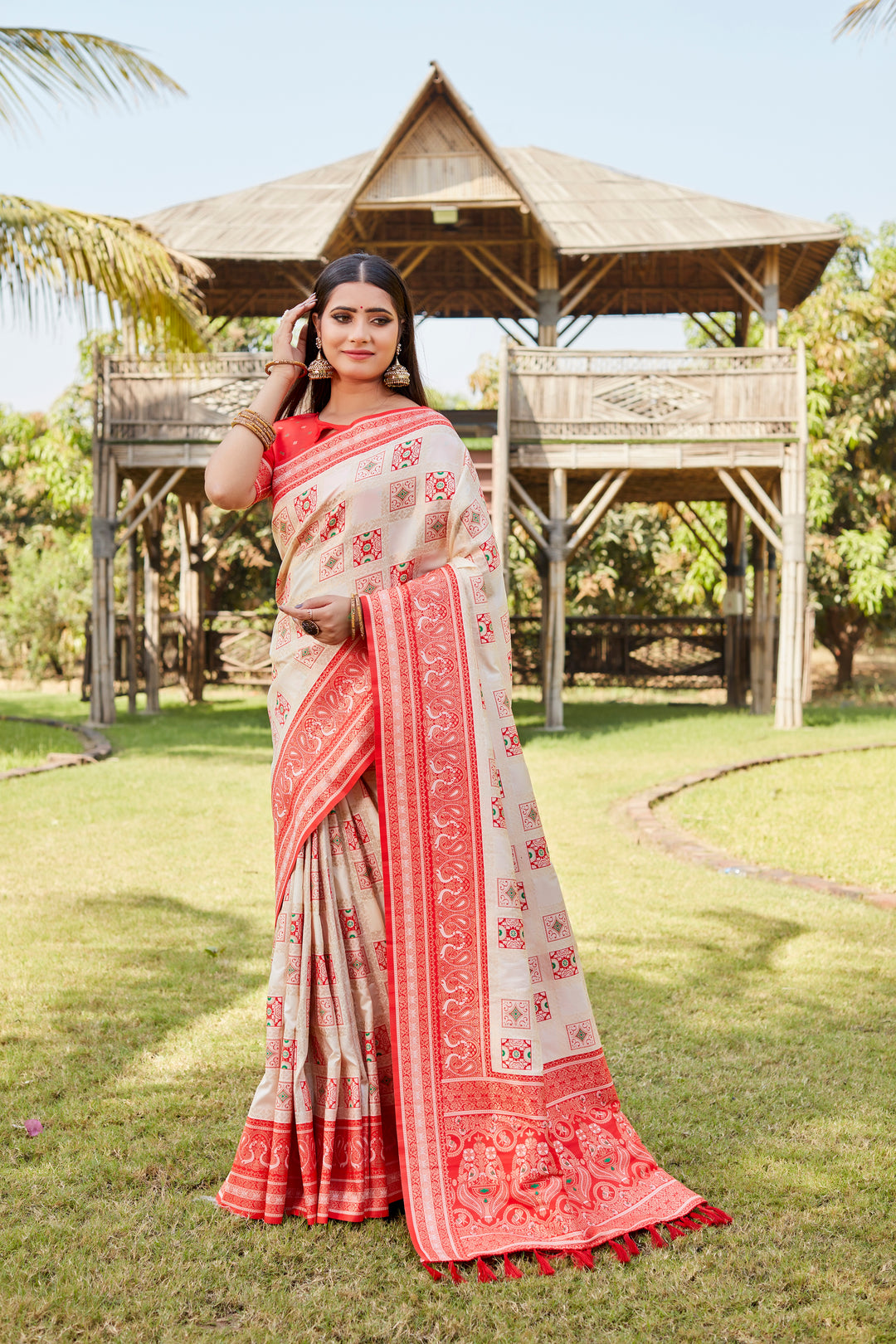 Timeless cream Kanjivaram soft silk saree with beautiful designer borders and detailed work.