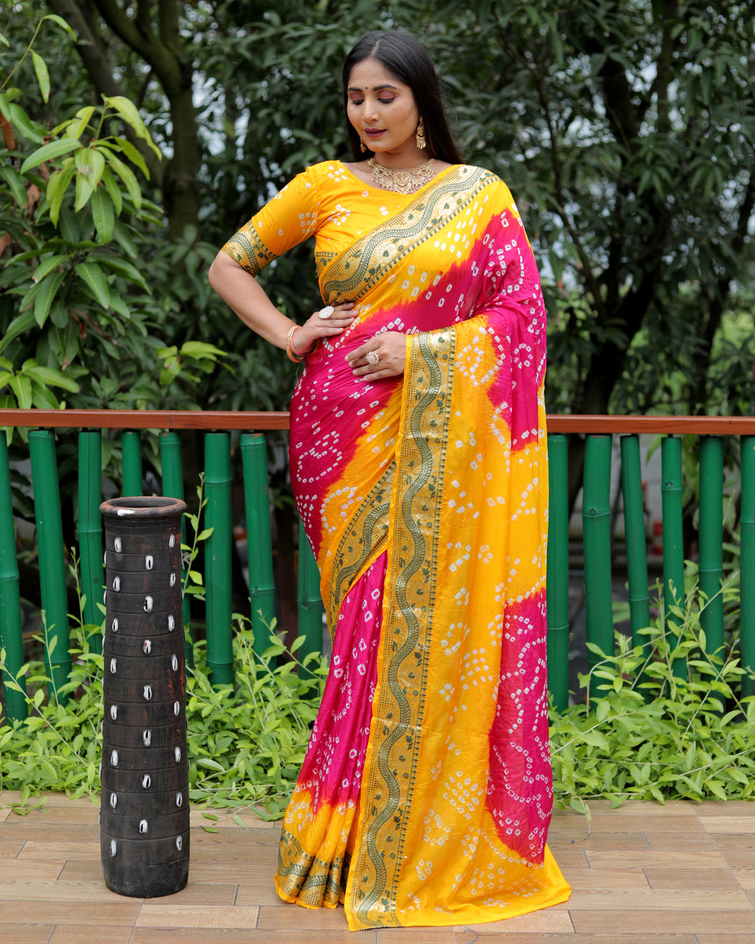 Bright-pink Bandhej Tapeta silk saree with beautiful dual-tone color pairing and Bandhej craftsmanship.