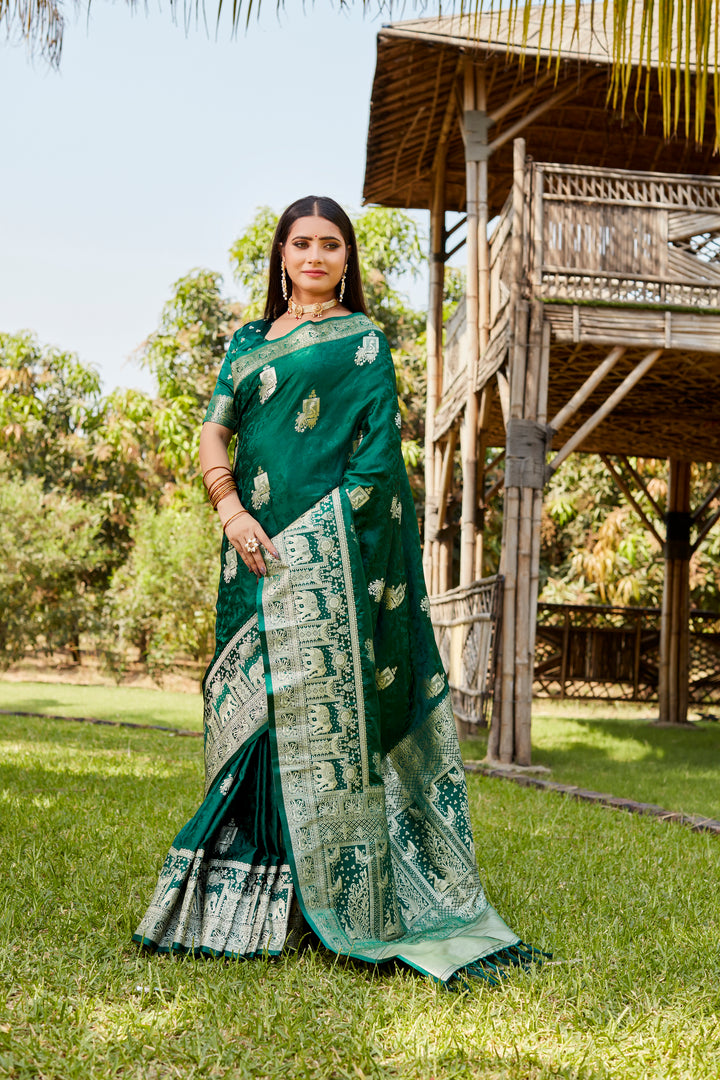 Rich red satin Kanjivaram saree featuring a traditional elephant border design, perfect for weddings and cultural events.