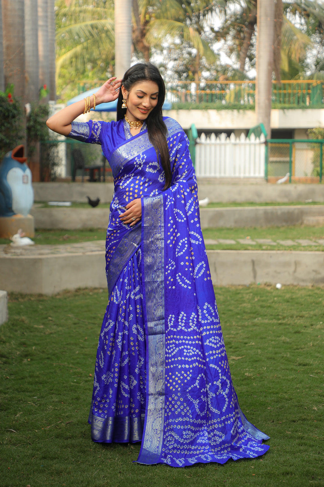 Gorgeous royal blue Bandhej silk saree with a stunning jari weaving border and Bandhej pallu, ideal for weddings.