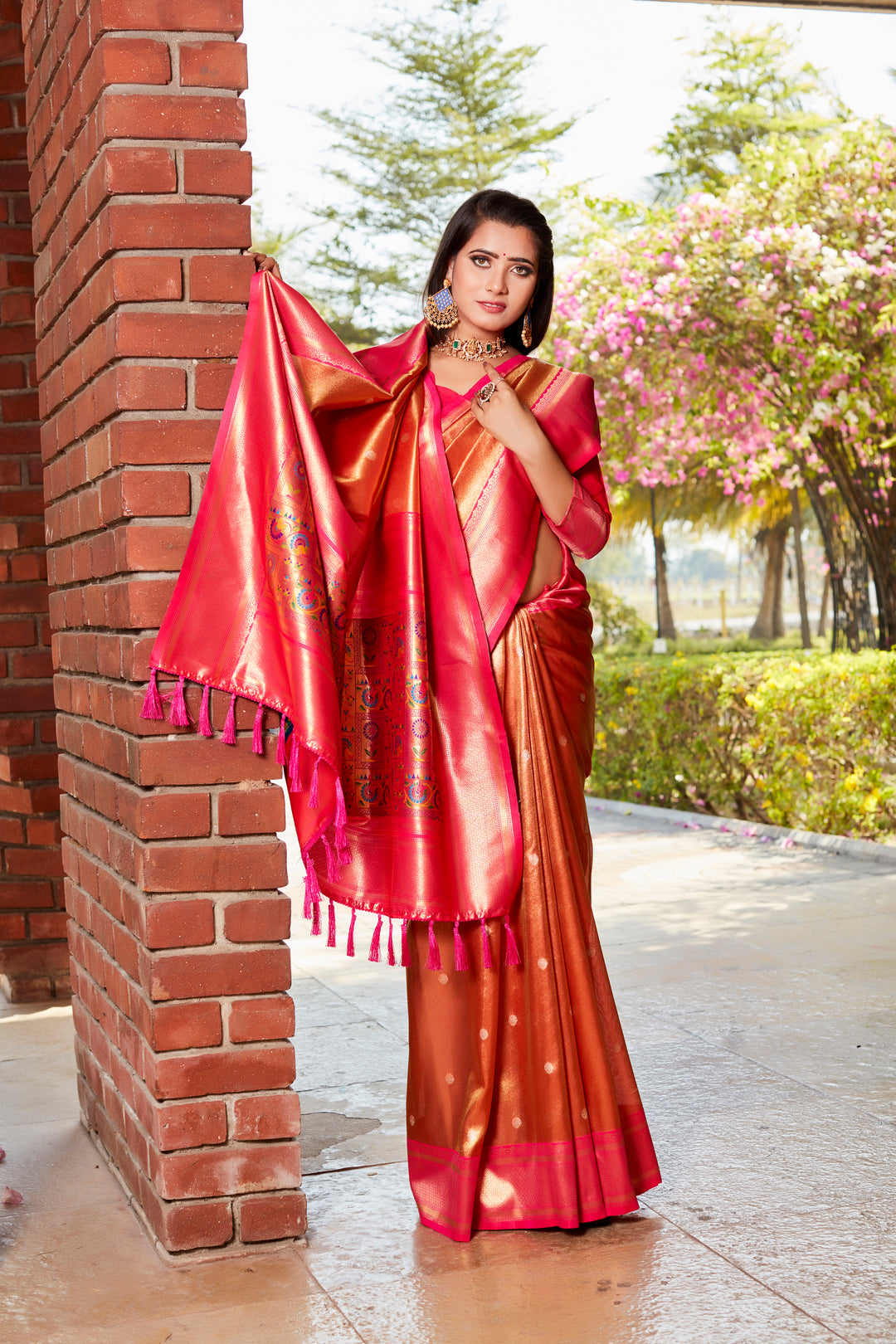 Elegant red tissue silk saree featuring a beautiful pallu and contrast blouse, ideal for traditional celebrations.