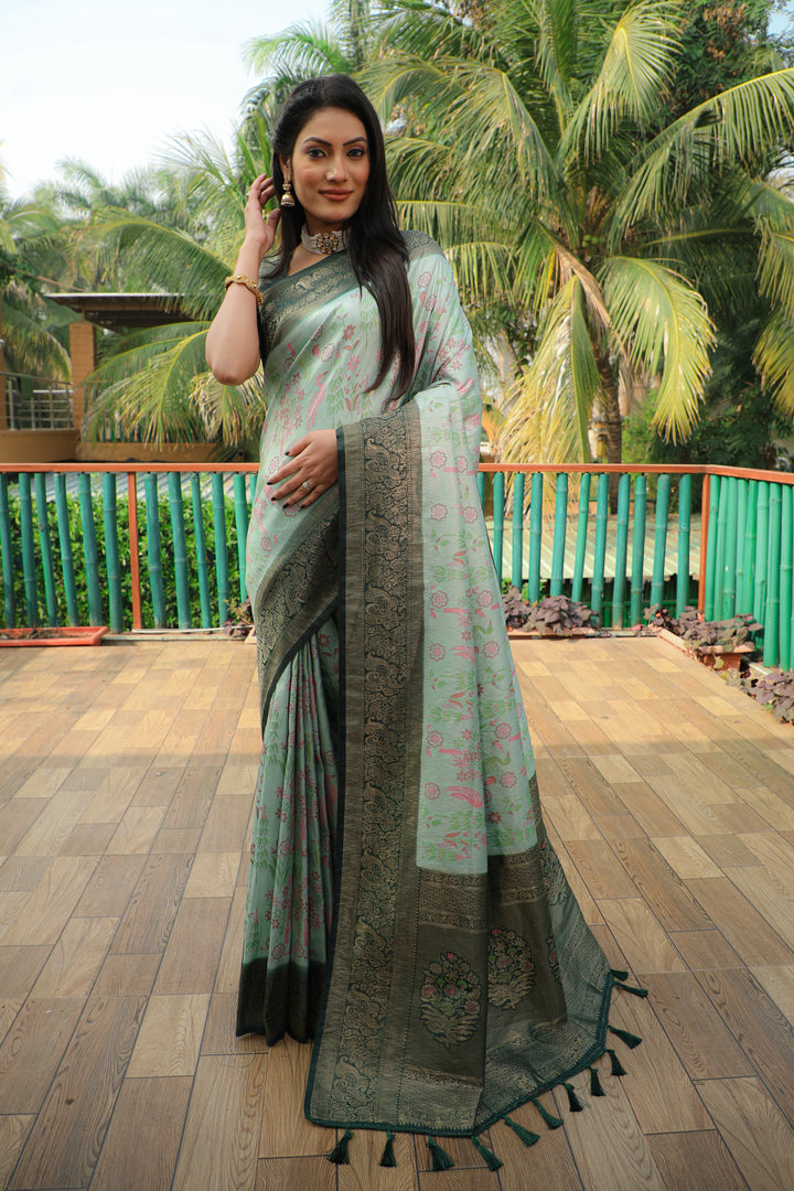 Elegant pista-green Kanjivaram soft silk saree with intricate weaving and a heavy blouse for traditional celebrations.