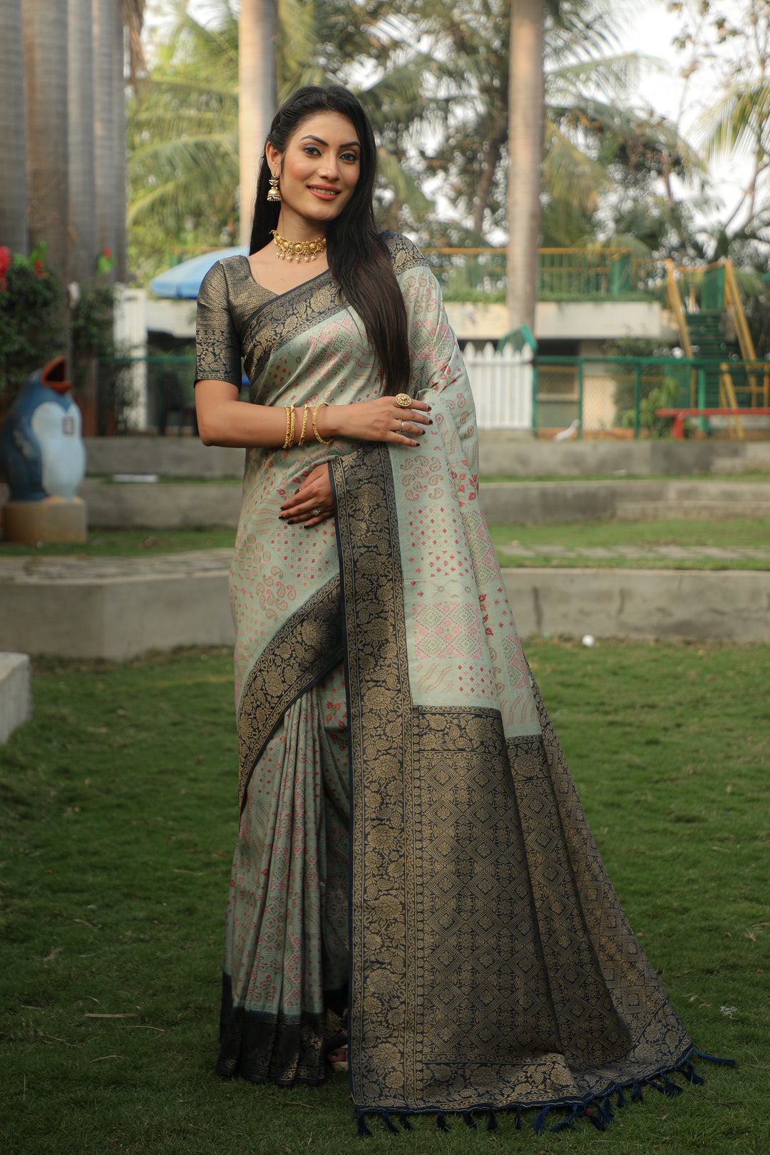 Elegant pink Kanjivaram silk saree with intricate work and rich colors, perfect for special occasions.