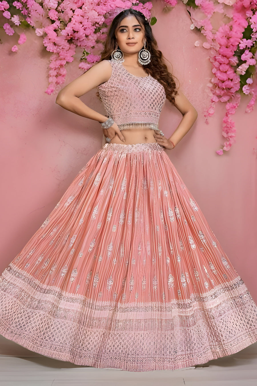 Peach georgette crop top lehenga set featuring a trendy floral skirt, ideal for festive occasions.