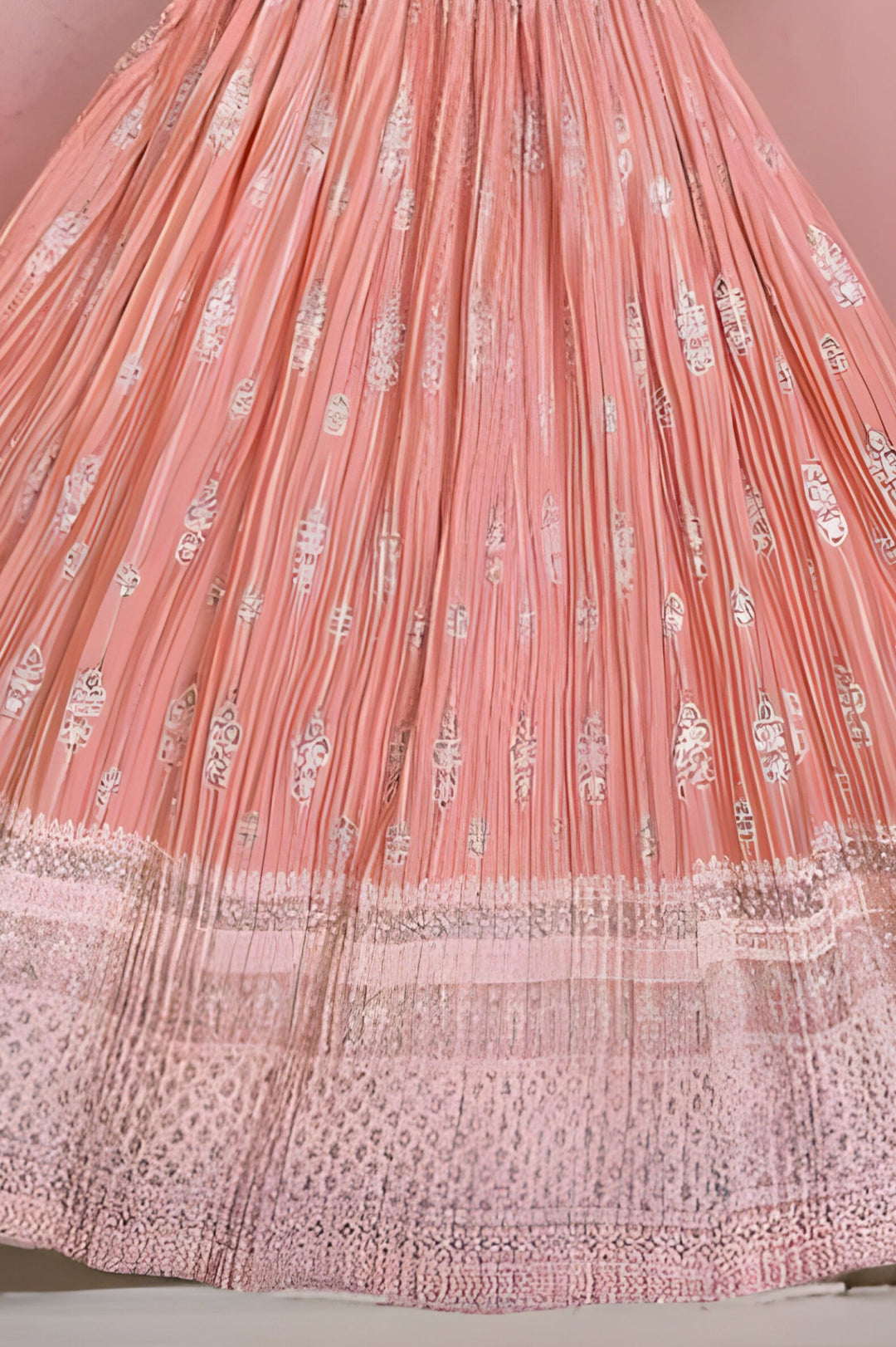 Elegant peach crop top and skirt combination for weddings and parties.