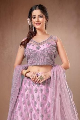 Beautiful pink crop top lehenga crafted from lightweight net fabric, perfect for weddings and parties.