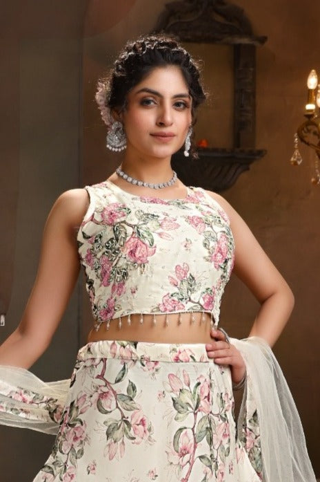 Elegant white lehenga set featuring a floral crop top in organza, ideal for weddings and special celebrations.