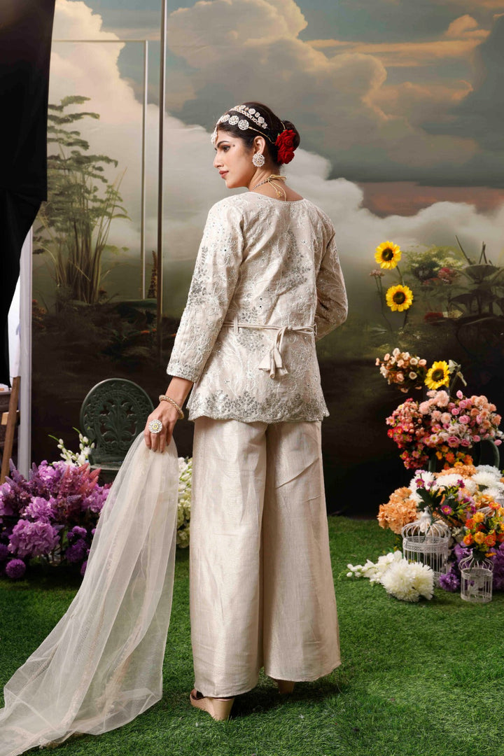 Chic cream outfit featuring palazzo pants and top in chinon, a perfect choice for women’s wear.