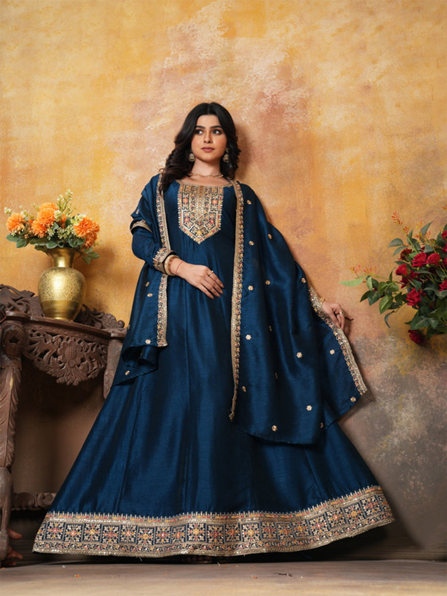 Deep sea blue ball gown dress made from Vichitra silk, featuring elegant pleats and a front slit.