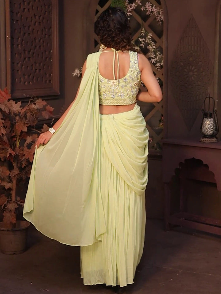 pista green lehenga with a floral crop top, designed for women’s fashion.