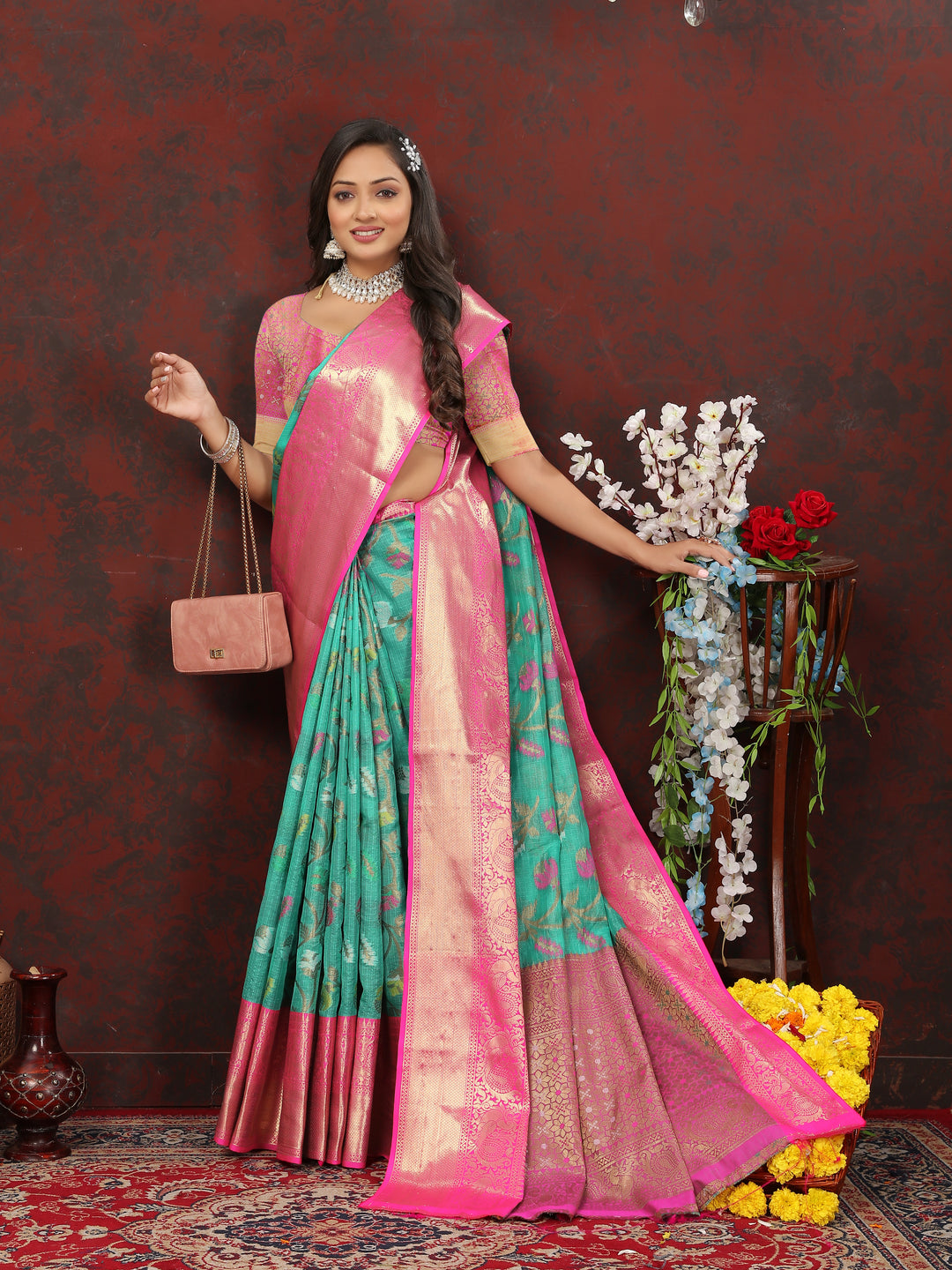 Stylish sea-green saree with Meenakari detailing and zari pallu, ideal for cultural and festive events.