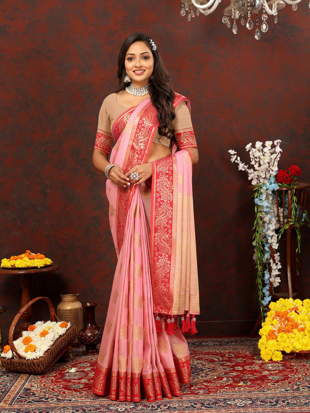 Classic pink cotton saree with exquisite zari pallu, complemented by a silk blouse piece, for special events.