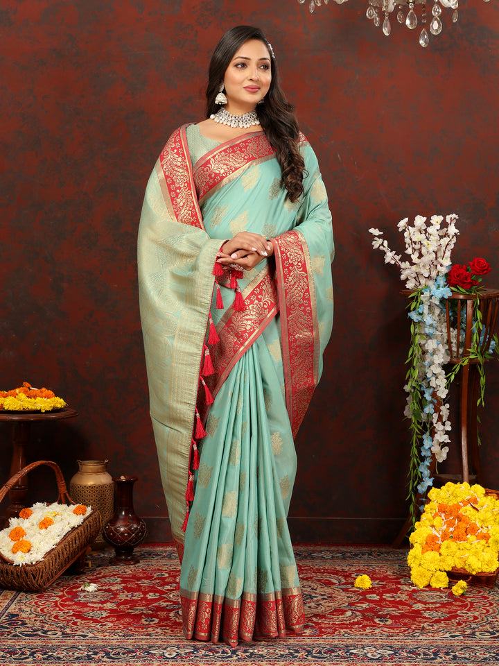 Sophisticated sky blue cotton saree with detailed zari pallu and silk blouse, perfect for grand occasions.