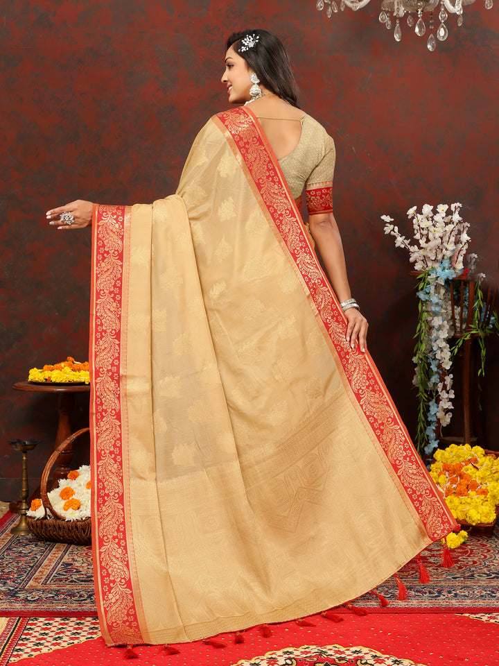 Beige designer cotton saree with detailed zari pallu and silk blouse, perfect for formal gatherings.