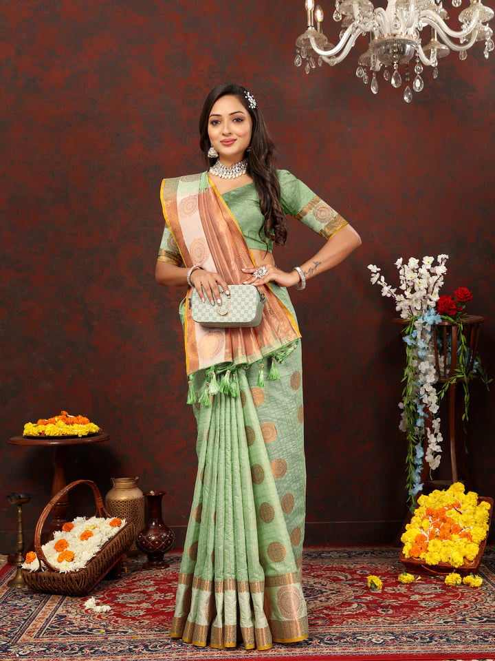 Luxurious green saree with zari work, perfect for weddings and grand celebrations.