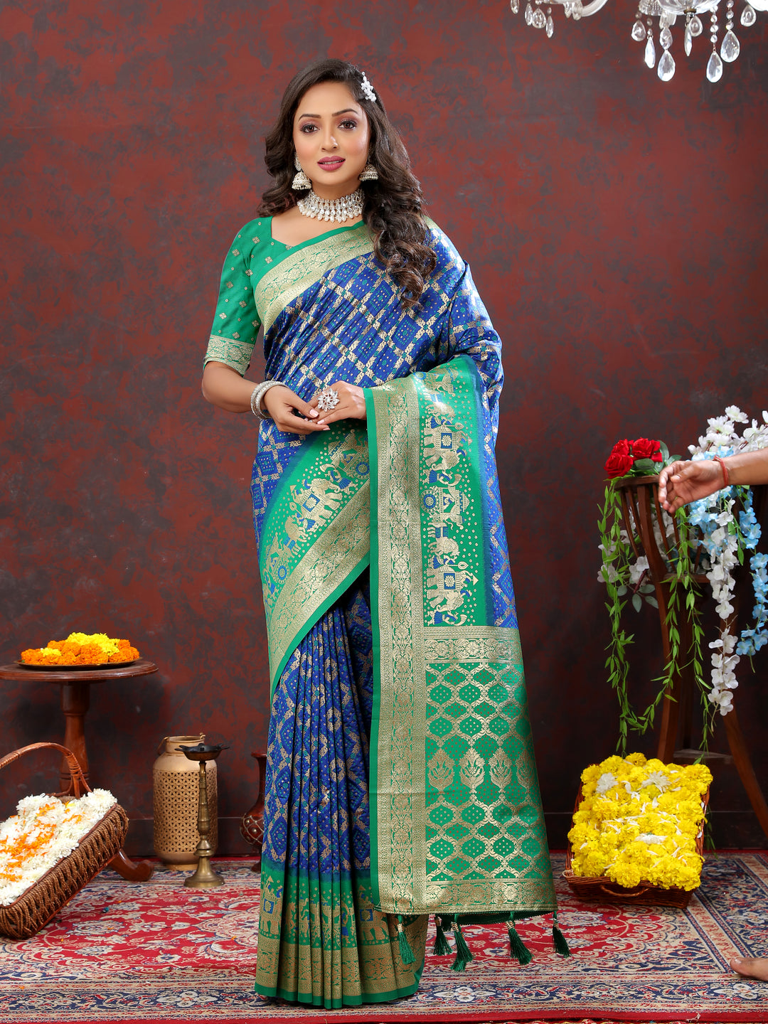 Elegant blue Patola silk saree with intricate Meenakari weaving and a beautiful zari border, perfect for festive occasions.