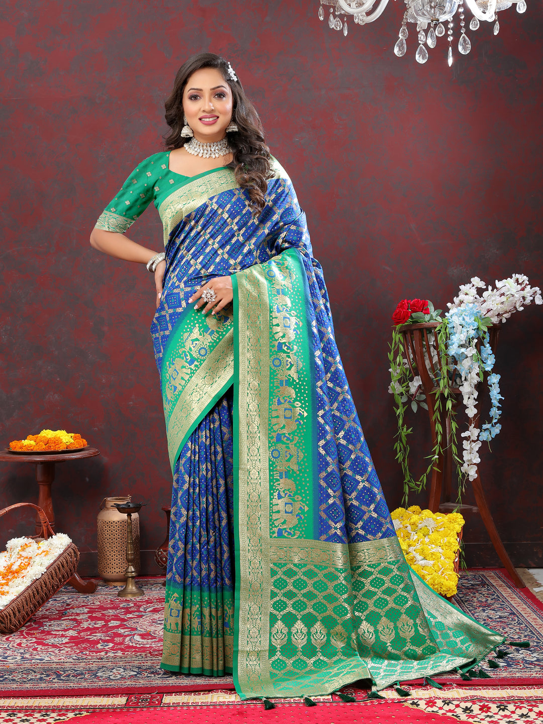 Blue Patola silk saree featuring exquisite Meenakari work, with a rich zari border and tassels for a traditional look.